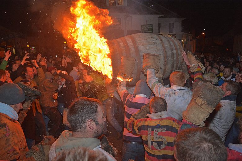 Tar Barrel Racing Running with Flaming Barrels Through the Streets in Devon, England
