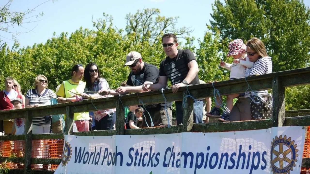 World Pooh Sticks Championships. Racing Twigs on a River in Oxfordshire, England